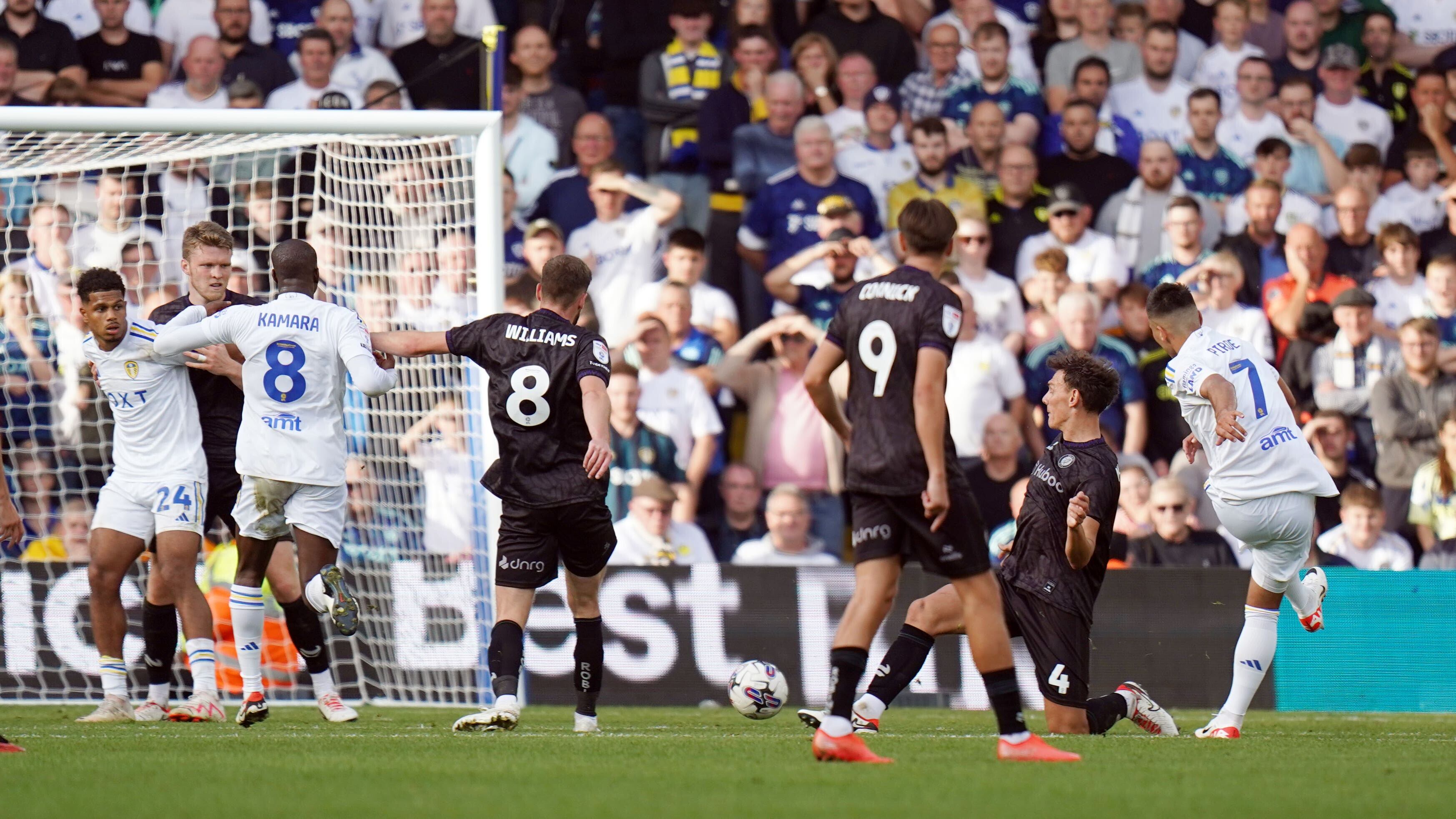 Leeds’ Joel Piroe (right) scores the winner (PA)