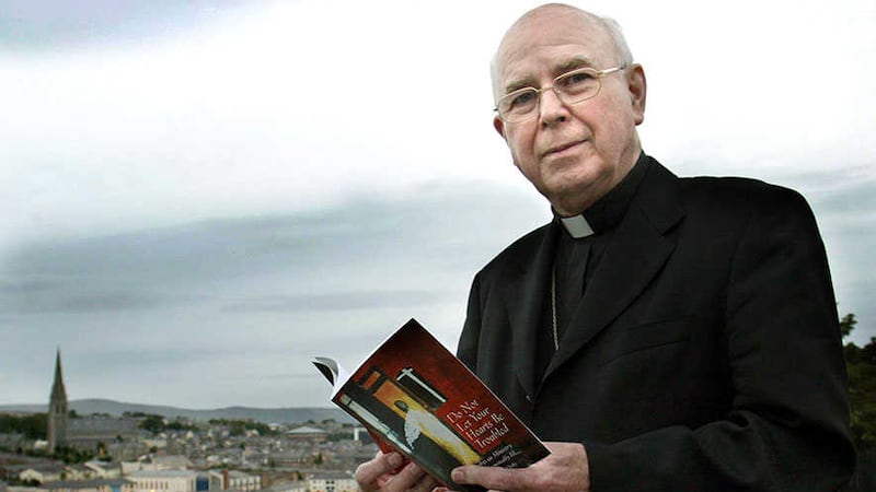 Bishop Edward Daly holds a copy of his book Don't Let Your Heart Be Troubled - Thoughts on Ministry To The Terminally Ill. Picture by Margaret McLaughlin&nbsp;