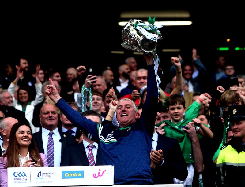 Limerick manager John Kiely holding Liam MacCarthy Cup in 2023