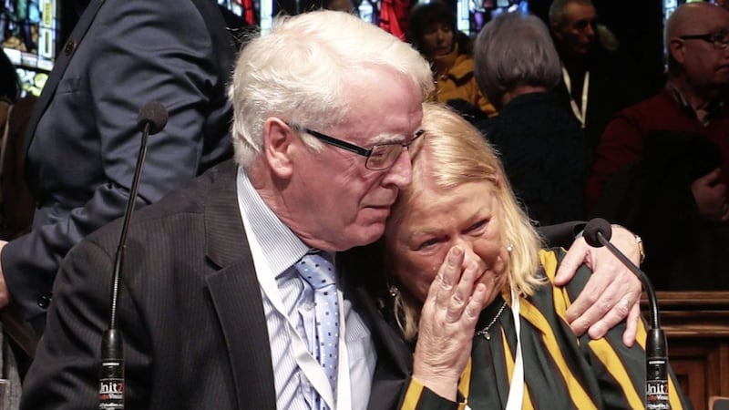 John Kelly comforts Alana Burke at the Guildhall in Derry, after the announcement from the Public Prosecution Service that one former paratrooper, soldier F is to be charged with two murders and four attempted murders during Bloody Sunday in 1972