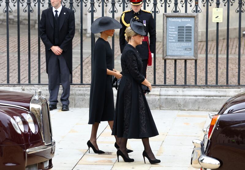 The Duchess of Sussex (left) and Countess of Wessex arrive at the State Funeral of Queen Elizabeth II,