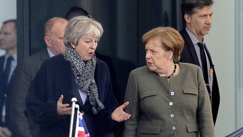 German chancellor Angela Merkel, right, and British prime minister Theresa May, talk teach other after a meeting at the chancellery in Berlin, Germany on Tuesday Picture by Markus Schreiber/AP 