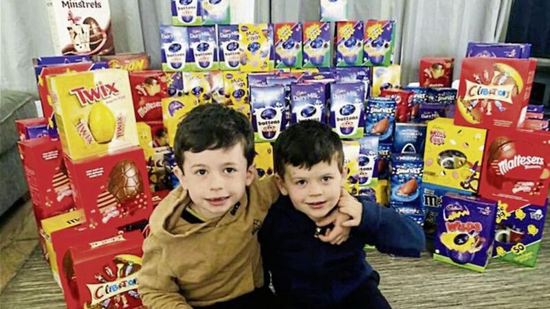 DONATION: Adam (6) and Jake (4) Brennan with some of their collection of 270 Easter eggs which they are planning to donate to Daisy Hill Hospital in Newry tonight for staff and young patients 