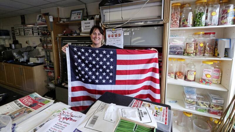 Sharon Pinder sells US flags as the village of Doonbeg prepares for the arrival of US president Donald Trump Picture by Niall Carson/PA 