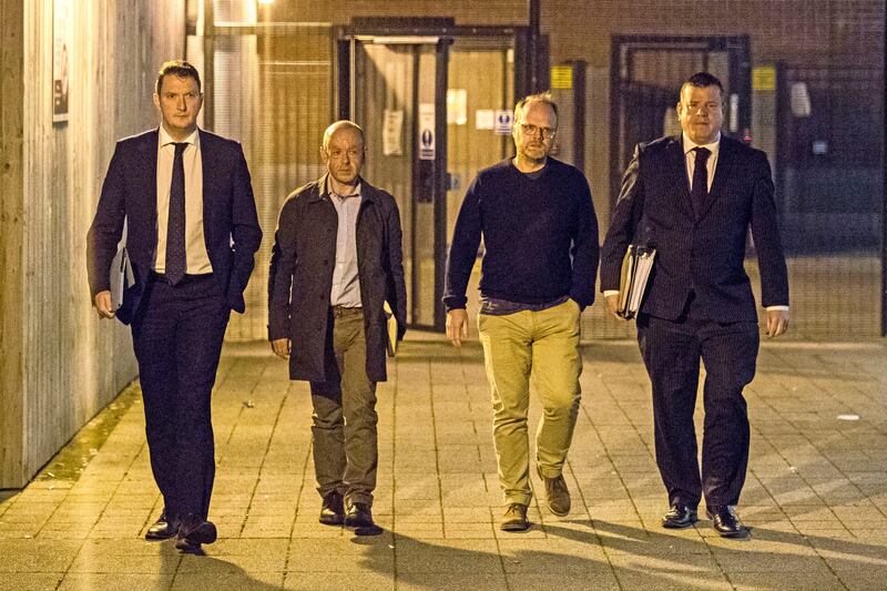 Barry McCaffrey (centre left) and Trevor Birney (centre right) with solicitors Niall Murphy (right) and John Finucane (left) leaving Musgrave Street police station in Belfast after their arrest in 2018