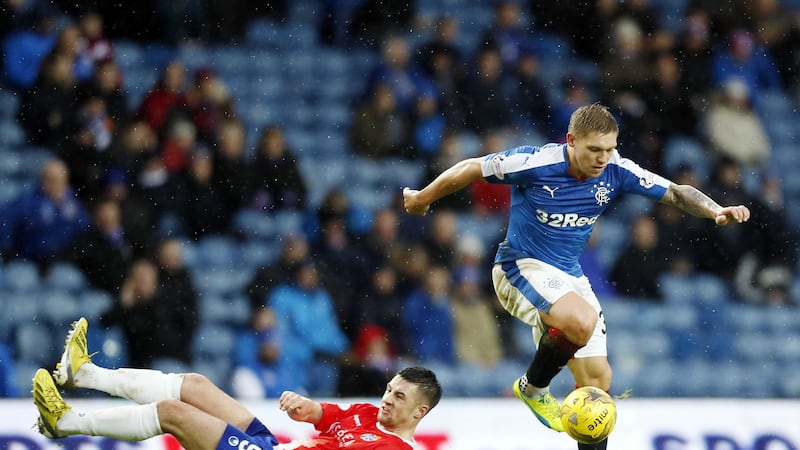 <span style=" line-height: 20.8px;">Cowdenbeath's Liam Callaghan is left on his backside by Rangers' Martyn Waghorn during the Scottish Cup fourth round match at Ibrox on Sunday<br /><br /></span>
