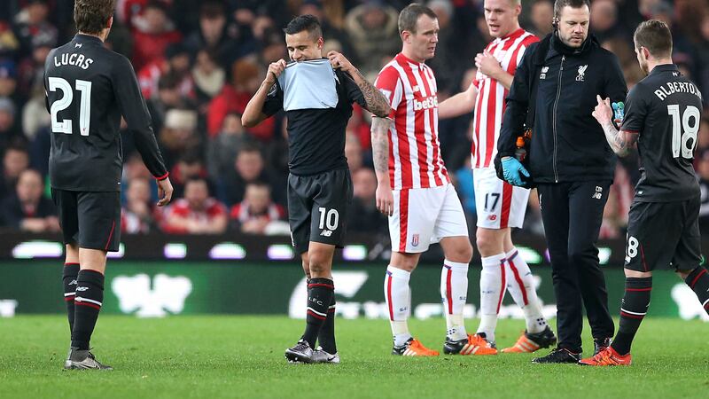 Liverpool's Philippe Coutinho hobbles off after pulling a hamstring in Tuesday night's Capital One Cup semi-final against Stoke<br />Picture by PA&nbsp;
