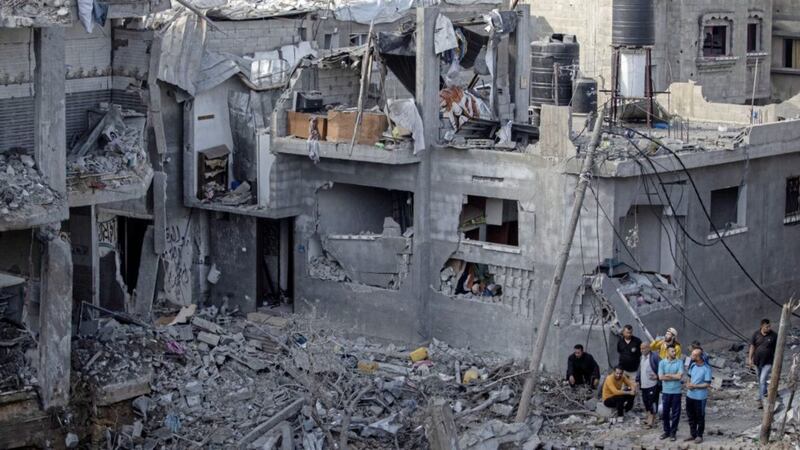 Palestinians inspect their destroyed houses following overnight Israeli airstrikes in town of Beit Hanoun, northern Gaza Strip, Friday May 14, 2021. Picture by AP Photo/Khalil Hamra 