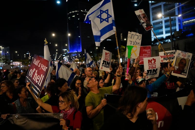People take part in a protest in Tel Aviv against the Israeli government and call for the release of hostages held in the Gaza Strip by Hamas (Ariel Schalit/AP)