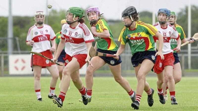 Derry&#39;s Mairead McNicholl in action with Leanne Nolan and Keeva Collins of Carlow at Swatragh. Picture by Margaret McLaughlin. 