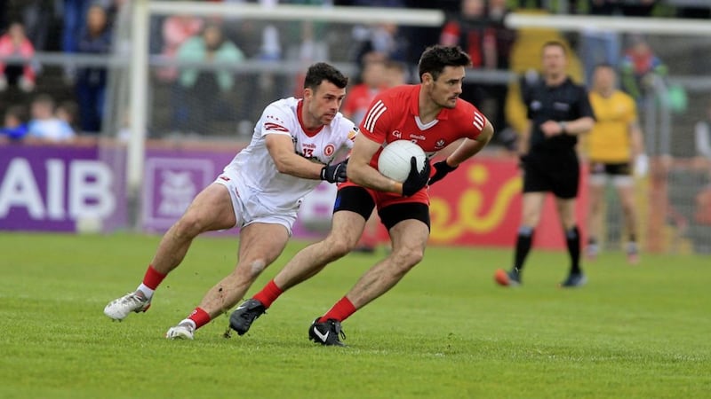 Tyrone's Darren McCurry takes on Derry defender Christopher McKaigue. <br />Picture Seamus Loughran