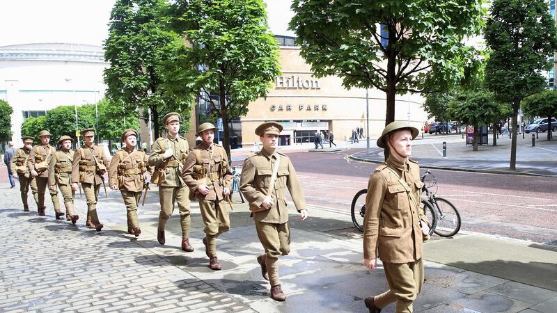 Actors dressed in World War One costume, organised by Belfast Lyric, walk through Belfast to mark the Centenary of the Somme. Pic by Cliff Donaldson