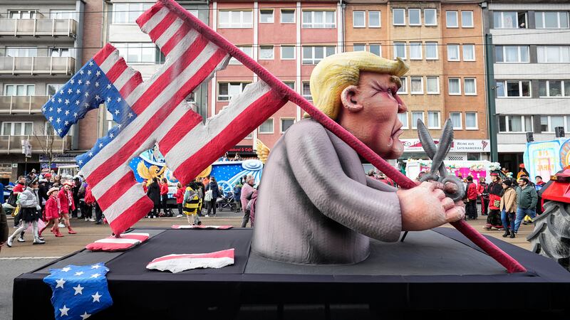 Carnival floats address current political issues both in Germany and abroad, with Donald Trump a particular focus (AP Photo/Martin Meissner)