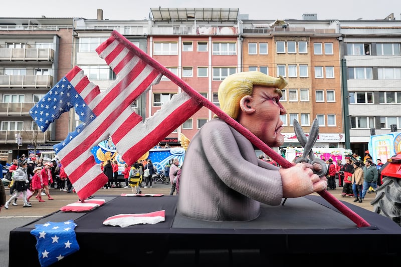 Carnival floats address current political issues both in Germany and abroad, with Donald Trump a particular focus (AP Photo/Martin Meissner)
