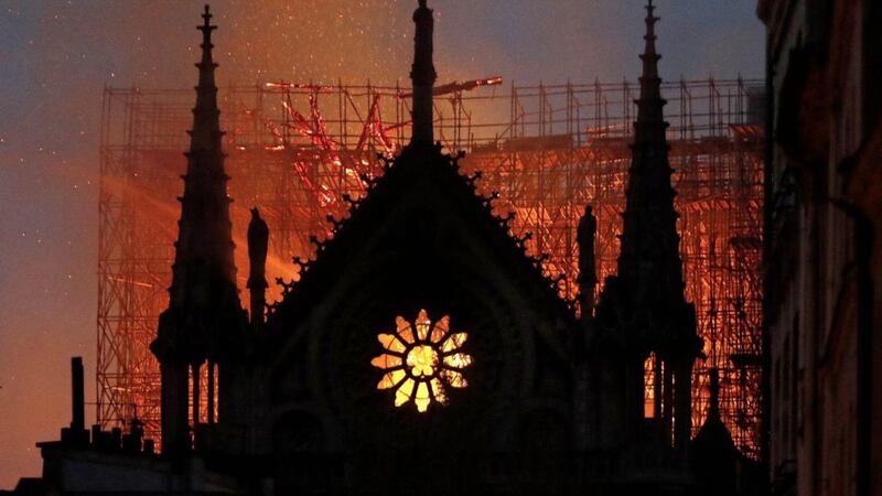 Flames and smoke rise from Notre Dame cathedral, pictured on Monday April 15 as the devastating fire took hold. Picture by AP Photo/Thibault Camus 