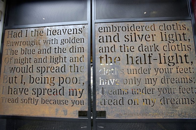 The front gate with He Wishes For The Cloths of Heaven, written by WB Yeats for Maud Gonne, forms part of the Irish poetry courtyard. Picture by Mal McCann