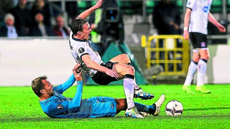 Dundalk&rsquo;s David McMillan is brought down by Zenit St Petersburg&rsquo;s Domenico Criscito (left) during the Uefa Europa League Group D clash at Tallaght Stadium last night. Left: Ronan Finn reacts after missing a chance.&nbsp;Picture: PA