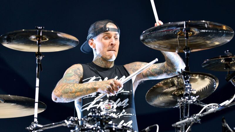The Blink-182 drummer made a surprise appearance on stage alongside rapper Machine Gun Kelly.