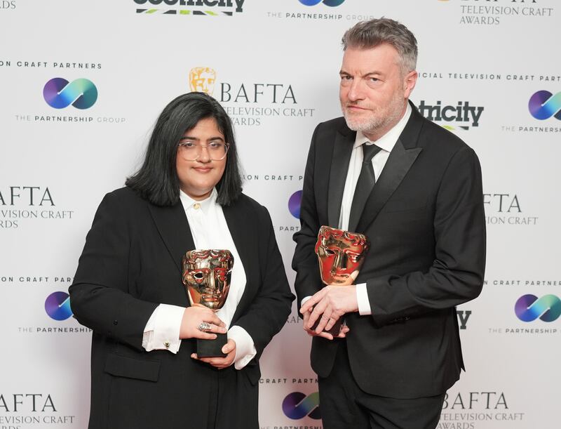 Charlie Brooker and Bisha K Ali with their awards for Black Mirror’s Demon 79