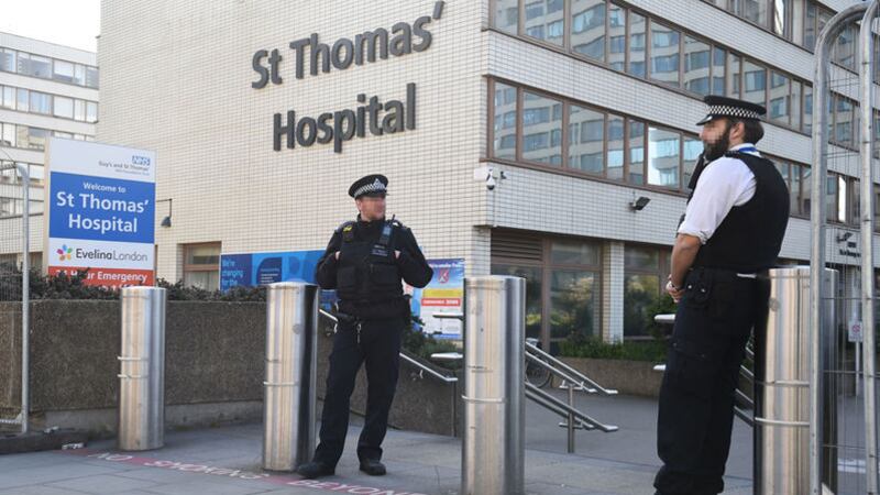 Police officers outside St Thomas' Hospital in central London where British prime minister Boris Johnson is in intensive care as his coronavirus symptoms persist. Picture by Kirsty O'Connor/PA Wire&nbsp;