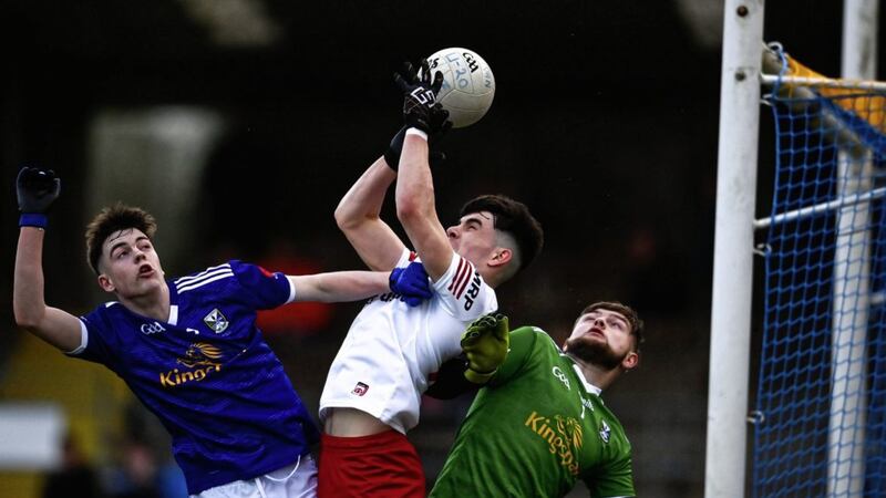 Conor Cush of Tyrone in action against Eoghan Hartin, left, and Jake Norris of Cavan during the EirGrid Ulster GAA Football U20 Championship Final match between Cavan and Tyrone at Brewster Park in Enniskillen Fermanagh Picture: David Fitzgerald/Sportsfile. 