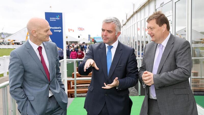 Enterprisem minister Jonathan Bell, centre, at the Balmoral Show with Prof Chris Elliot, QUB and Michael Bell, NIFDA 