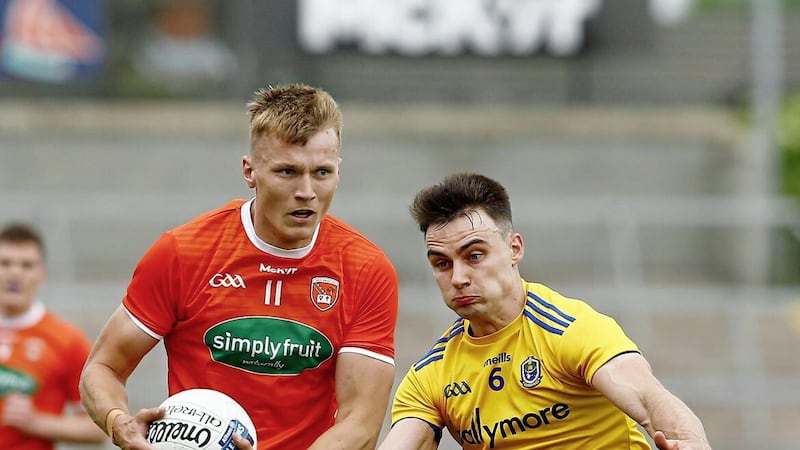 Armagh&#39;s Rian O&#39;Neilland Roscommon&#39;s  Conor Hussey in action during the GAA Allianz Football league division one Relegation play-off between Armagh and Roscommon at the Athletics ground Armagh on June -13-2021. Pic Philip Walsh 