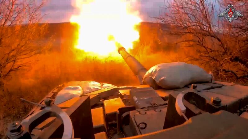 A Russian tank fires at Ukrainian troops from a position near the border with Ukraine in Russia’s Belgorod region (Russian defence ministry via AP)