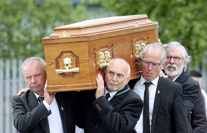 Sean Hughes, Sean Murray, Gerry Kelly and Gerry Adams carry the coffin of their friend Bobby Storey. Picture by Mal McCann