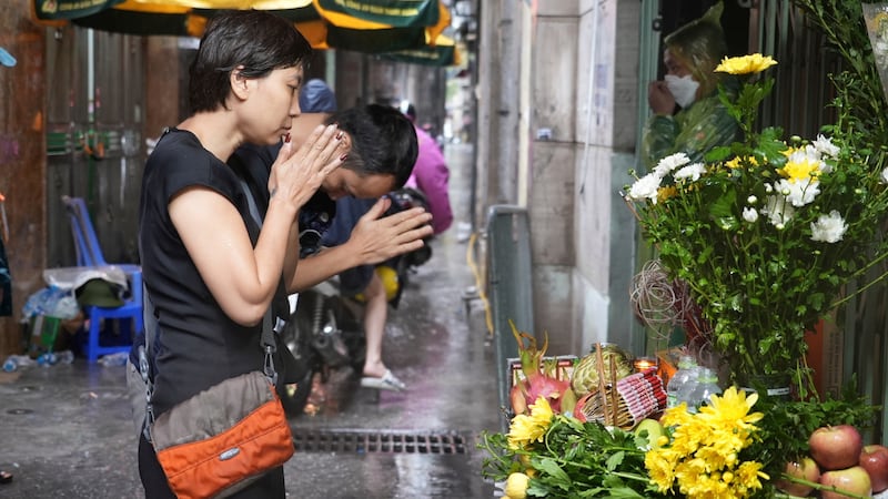 A shrine was set up in front of the building (Hau Dinh/AP)