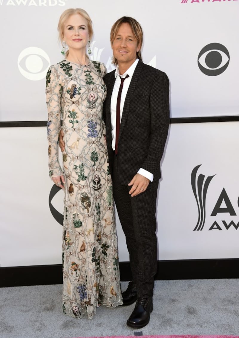 Nicole Kidman, left, and Keith Urban arrive at the awards (Jordan Strauss/Invision/AP)