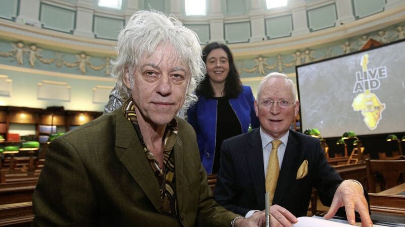 Sir Bob Geldof, left, signing a contract at the National Library of Ireland in Dublin with Chairman Paul Shovlin and library director Dr Sandra Collins, when he announced that the Band Aid Trust was donating its archive to the NLI. Picture by Brian Lawless, Press Association