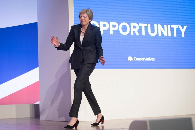 Prime Minister Theresa May dances as she arrives on stage to make her keynote speech at the Conservative Party annual conference 