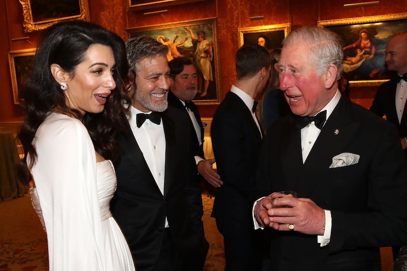 The Prince of Wales speaks to Amal and George Clooney