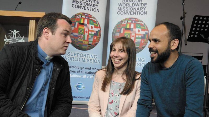 Rev Andrew Campbell, curate at Bangor Abbey, Marlene Ferguson from Wycliffe Bible Translators and Nathaniel Jennings, from mission agency OMF, talk together at the launch of Bangor Worldwide&#39;s 2015 programme 
