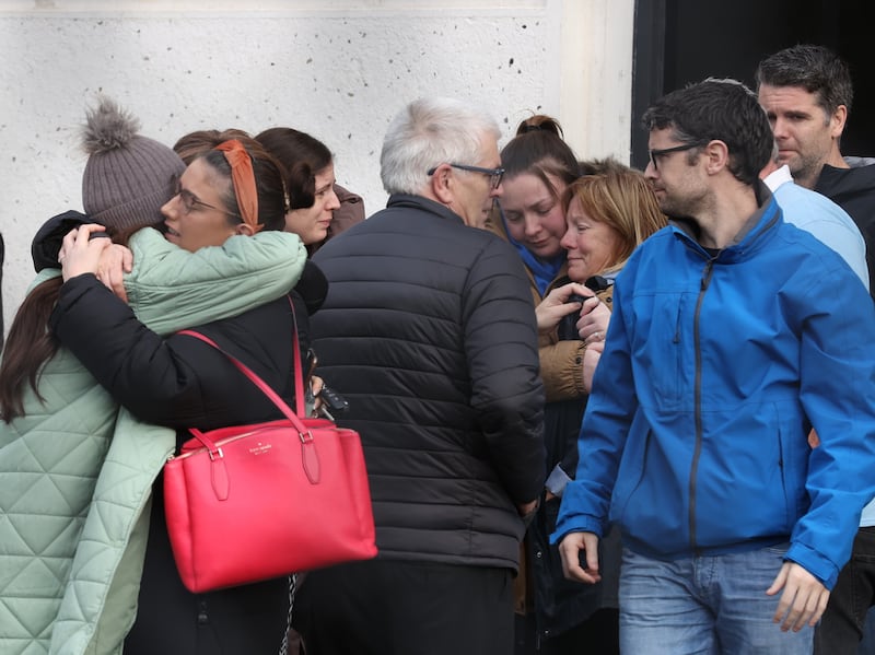 Friends, family members and supporters of murder victim Natalie McNally embrace each other outside Lisburn Courthouse, where Stephen McCullagh, 32, from Woodland Gardens, Lisburn, was remanded in custody