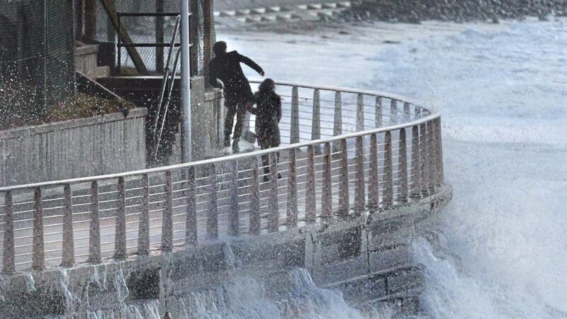 Raging waves swamp people walking the promenade area in Portrush Co Antrim on Saturday last week as Storm Dylan roared across Ireland 
