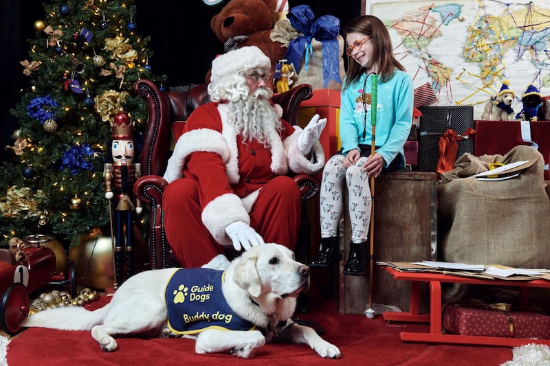 A girl speaks to Father Christmas