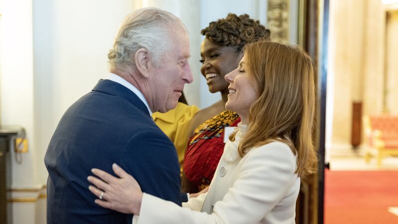 The singer whispered into Charles’s ear at a Buckingham Palace reception.