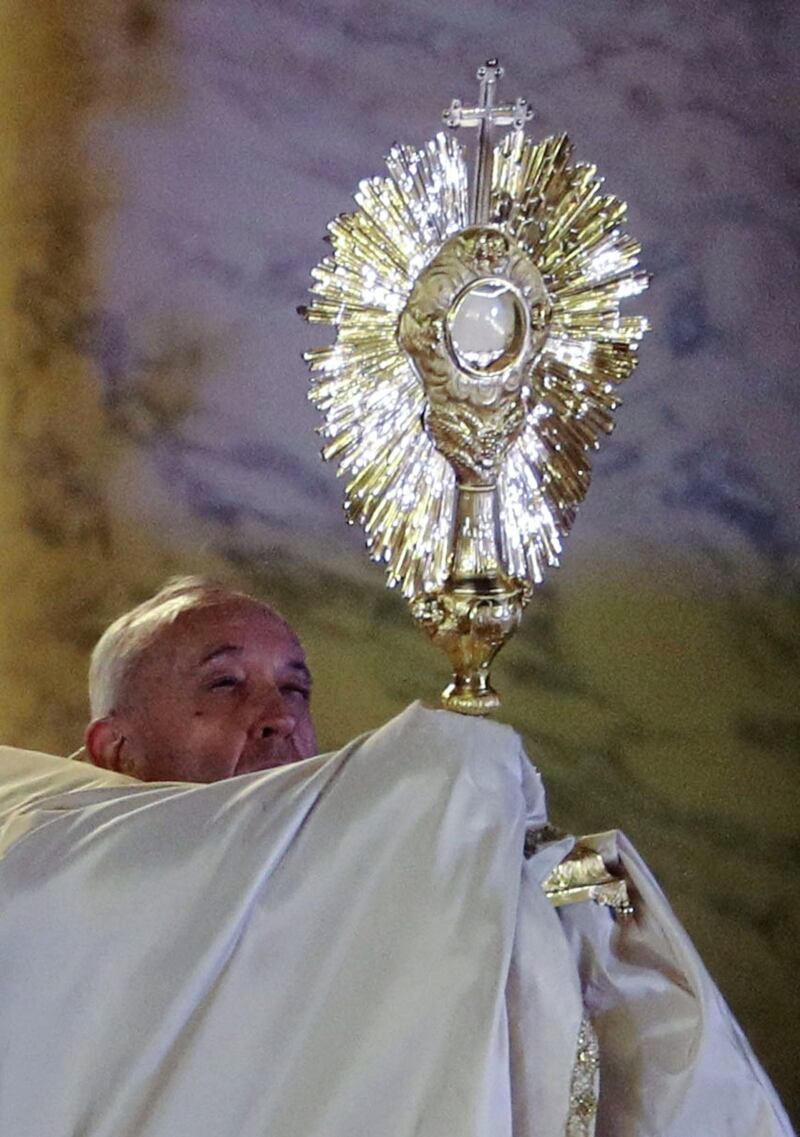 Pope Francis holds up a monstrance during a prayer at the entrance of St. Peter&#39;s Basilica. Picture by Yara Nardi/Pool Photo via AP 