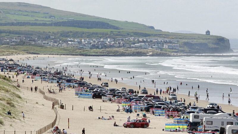 Thousands make the most of the sizzling weather on the causeway coast at Portstewart Strand in County Derry on Sunday as the bank holiday weekend temperatures soar. Picture Margaret McLaughlin. 