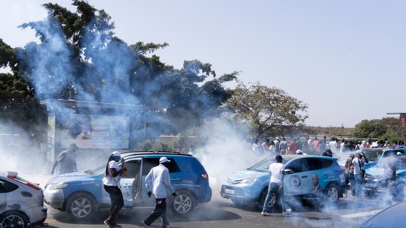 Senegalese riot police fire tear gas at supporters of opposition presidential candidate Daouda Ndiaye, in Dakar, Senegal (Stefan Kleinowitz/AP)