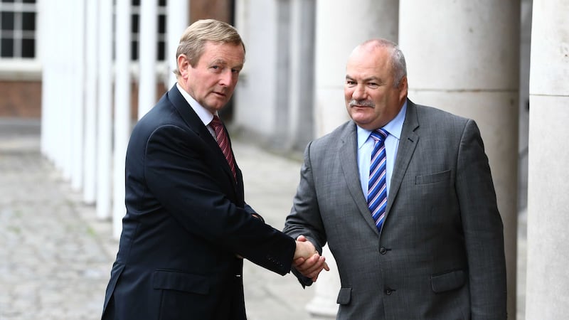 Taoiseach Enda Kenny, left, arrives for the North South Ministerial Meeting at Dublin Castle in Dublin, Picture by Brian Lawless, Press Association