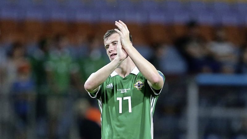 Northern Ireland&#39;s Paddy McNair applauds the fans after he scored a late winner away to Belarus last year. 