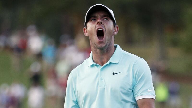 Rory McIlroy reacts after sinking a putt on the fourth hole to win the Tour Championship golf tournament and the FedEx Cup in Atlanta. Picture by AP Photo/John Bazemore 