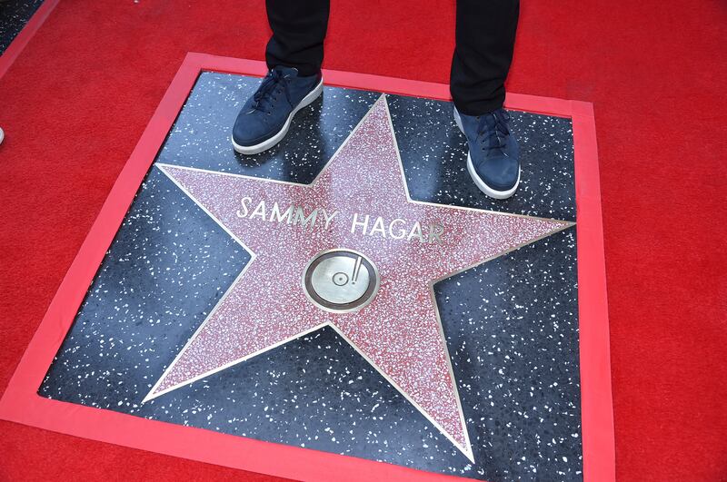 Sammy Hagar stands on his new star during a ceremony honoring Him with a star on the Hollywood Walk of Fame (Richard Shotwell/Invision/AP)