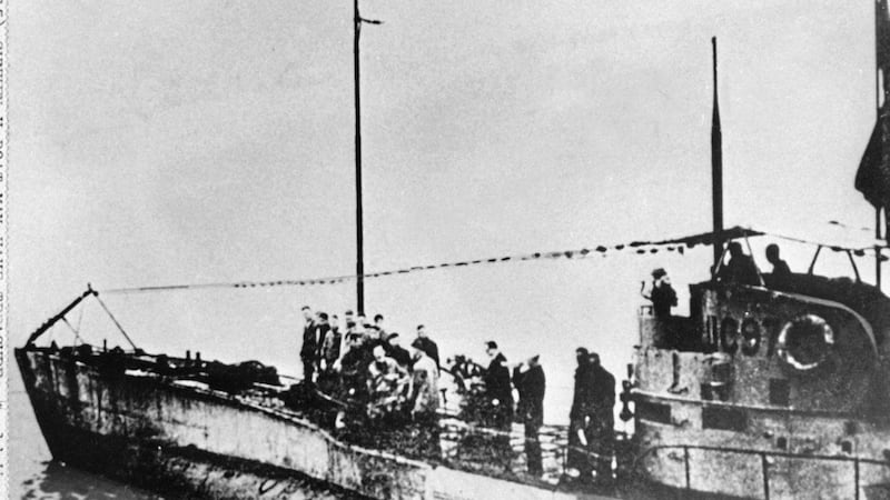 People stand on the deck of a World War I German submarine type UC-97 in an unknown location. Belgian regional authorities said on Tuesday that an intact German World War I submarine has been found off the coast of Belgium. Picture by Associated Press, File 