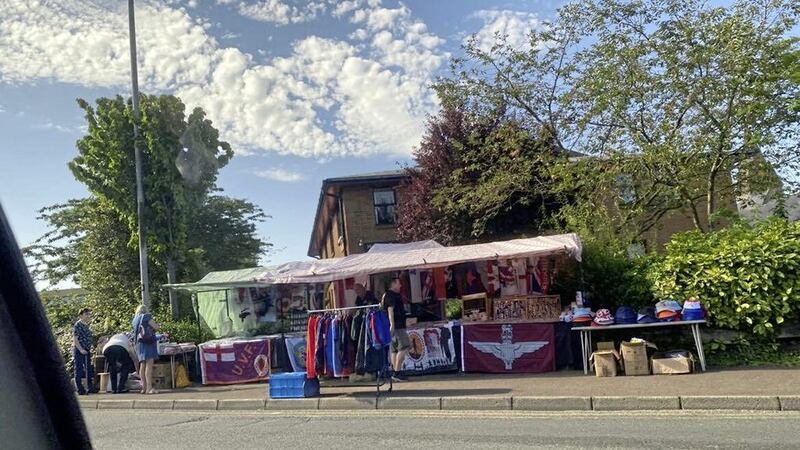 A stall selling UVF and Parachute Regiment flags on Glendermott Road in Derry