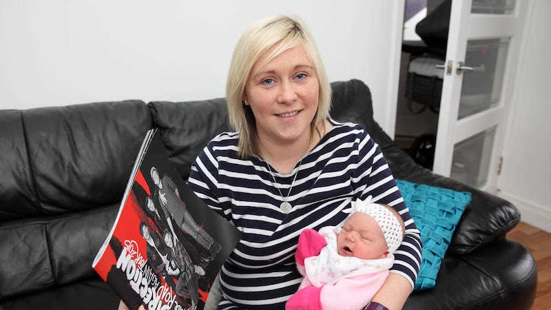 One Direction fan Julie-Anne Kirk and three-day-old baby Laiya. The Belfast woman went into labour at one of the band&#39;s concerts. Picture by Cliff Donaldson 