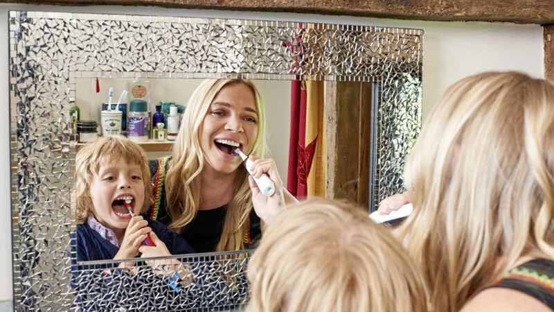 Jodie Kidd brushing her teeth with son Indio as part of the Big Family Brush Up dental campaign 